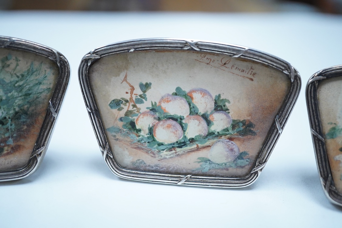 A set of four white metal and inset floral painted panel menu holders, signed Le Maitre, width 58mm, metal unmarked.